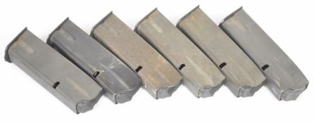 Six Browning 9mm Hi-Power pistol magazines.