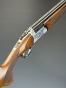 White Diamond Sapphire 12 bore over and under ejector shotgun with named and bored engraved locks