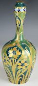 William Moorcroft Macintyre Florian Ware vase decorated in green and gold, with signed and printed