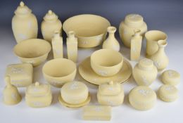 Large collection of Wedgwood primrose yellow Jasperware including covered ginger jars, pedestal