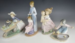 Four Lladro / Nao figures including 'A Barrow Of Fun', 2000 event figure 'Playing Mom', 'It's Your