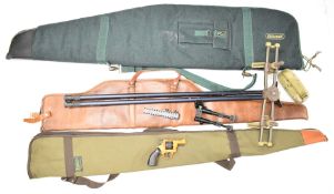 A collection of gun and shooting accessories including three shotgun or rifle slips, rifle rests,