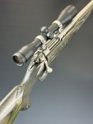 Ruger M77 Hawkeye .243 bolt-action rifle with laminate show wood stock, chequered semi-pistol grip