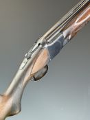 Browning B25 A1 12 bore over and under ejector shotgun with chequered semi-pistol grip and forend,