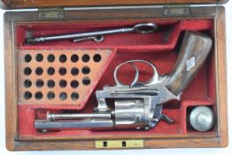 L Gasser of Vienna six-shot double action pocket revolver with wooden grips, fluted cylinder, framed