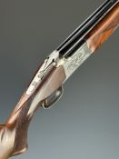 Browning 325 SP 12 bore over and under ejector shotgun with engraved scenes of birds to the locks,