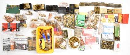 A large collection of rifle ammunition, cartridge cases, bullet heads, re-loading dies etc including