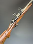 Winchester Model 70 .22-250 bolt-action rifle with laminate show wood stock, semi-pistol grip, sling