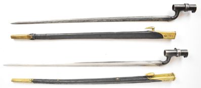 Two British Martini Henry socket bayonets, 54.5cm blades, one dated 4/85, both in brass and