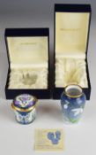 Moorcroft Enamels vase decorated with snowdrops and a hinged pillbox with floral decoration, both