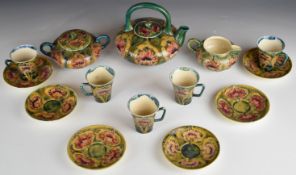 William Moorcroft fifteen piece tea set decorated in the Cornflower pattern on an early pale green