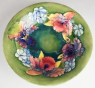 William Moorcroft pedestal bowl decorated in the Orchid / Spring Flowers pattern, signed to the base