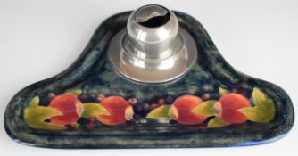 William Moorcroft standish decorated in the Pomegranate pattern, with pewter inkwell having hinged