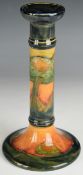William Moorcroft candlestick decorated in the Eventide pattern, circa 1920s, with signed and