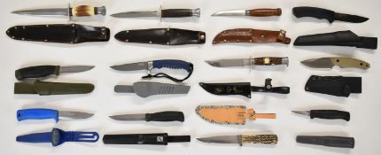 Twelve survival, hunting and skinning knives to include Buck 221, Morakniv Sweden, Boker Magnum,
