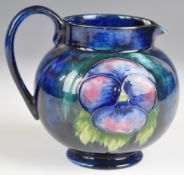 Moorcroft pedestal jug decorated in the Pansy pattern H12cm