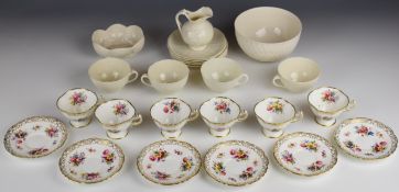 A collection of Aynsley and Belleek decorative tea ware including interior decorated Aynsley cups