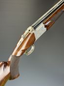 Browning B525 12 bore over and under ejector shotgun with engraved scenes of birds to the locks