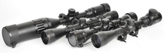 Four rifle scopes comprising Goetland 3-9x50 A0L, Hawke Sport HD 3-9x40, Nikko Stirling