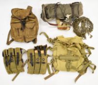 Two canvas machine gun magazine carriers, military rucksacks including one with Chinese writing