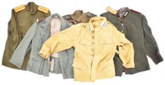 Five Russian / Soviet Union WW2 or later shirts / tunics with insignia