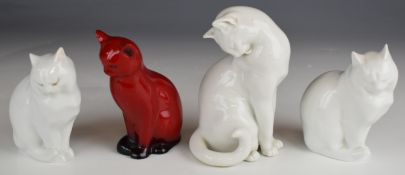 Four Royal Doulton and Herend seated cat figures including a flambé example, tallest 14.5cm and