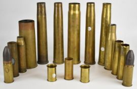 Sixteen brass shell cases including two for a German Geschutze VI machine cannon with bullet