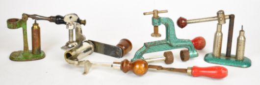 Four re-loading tools comprising 10 and 12 bore roll turnover tools and two cappers/ de-cappers.