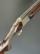 Nikko Model 5000 II 12 bore over and under ejector shotgun with engraved locks, trigger guard,