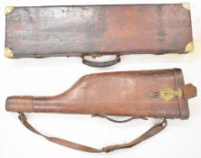 Two vintage leather and brass shotgun carry cases, one leg of mutton 79cm long, the other with brass