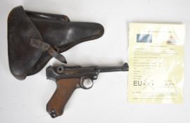 Deactivated German Luger semi-automatic pistol with chequered wooden grips, breech dated 1917,