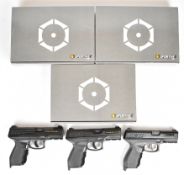 Three Cybergun 24/7 6mm CO2 airsoft pistols each with textured rubber grips and fixed sights, all