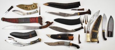 Five various Kukri knives to include a carved bone handled example and another with aluminium