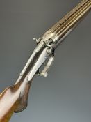 Unnamed 20 bore side by side hammer action shotgun converted from a double rifle with border