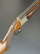 Browning 12 bore over and under ejector shotgun with engraved locks and underside, chequered semi-