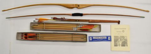 A collection of archery related items including two bows, Longshot arrows and a copy of Korean