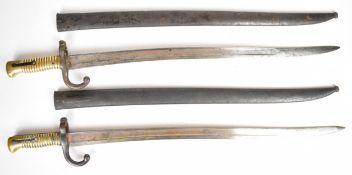 Two French Chassepot bayonets, 57cm blades etched 1869 and 1872 to back of blades, with metal