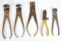 Five pairs of Colt and similar bullet moulds including a double cavity brass example, largest 16.5cm