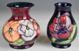 Two Moorcroft pedestal vases decorated in the Pansy and Anemone patterns, tallest 10cm