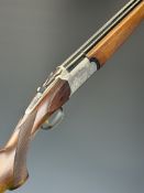 Silma 20 bore over and under ejector shotgun with engraved scenes of birds and dogs to the locks,