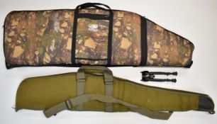 Two padded rifle slips including a Buffalio River double example, together with a leather rifle