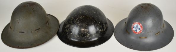 Three WW2 British civilian helmets comprising two 'Zuckerman' helmets, one with ARP for animals