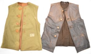 Two leather jerkins, one circa WW2 with applied label W. N. Curwen and also stamped WD with military