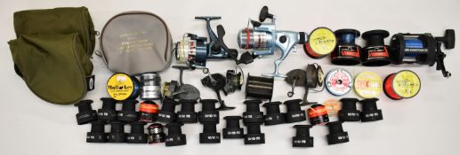 Collection of vintage to modern fishing reels and spare spools including multiplier, fixed spools