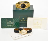Two Gucci wristwatches ref. 9200M with date aperture, gold hands and hour markers, black dial,