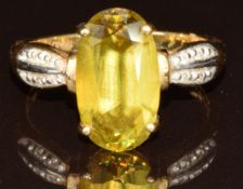 An 18k gold ring set with an oval cut Capelinha sphene of approximately 4.3ct, with certificate, 5g,
