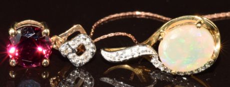 Two 9k gold pendants, one set with a round cut Umbalite and diamonds, on 9ct gold chain and the