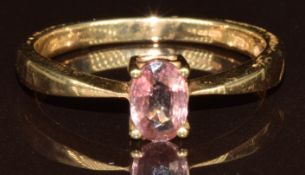 A 9k gold ring set with an oval cut pink zircon of approximately 0.6ct, with certificate, 2g, size