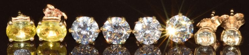 Four pairs of 9ct gold earrings, two pairs set with cubic zirconia, one pair topaz and the other