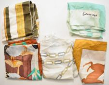 Five silk scarves including Must de Cartier with chain link decoration and Balenciaga in tonal